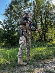 Russian soldier in occupied territory. Soldier patrols with an assault rifle