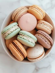 Fototapeta premium A colorful display of delicious macarons arranged in a bowl, perfect for dessert lovers and food photography.