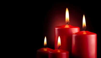 Four Red Candles Burning Brightly Against A Dark Background During A Calm Evening