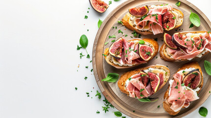 Delicious bruschettas with fig, cheese, prosciutto, and herbs on a wooden plate, copy space on white background, healthy breakfast idea. Top view.