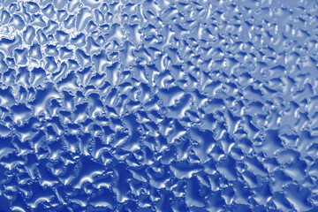 blue natural background: close up of frozen window