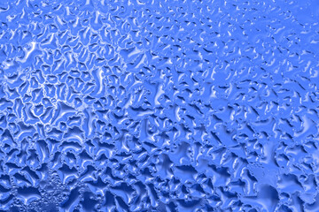 blue natural background: close up of texture on frozen window