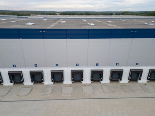 aerial drone view of warehouse building with bays 