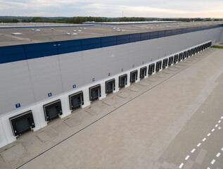 aerial drone view of warehouse building with bays 