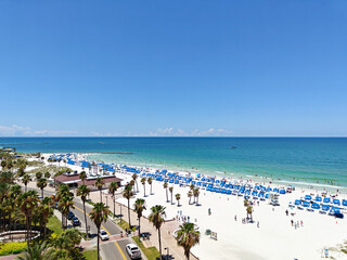 Obraz premium View of Clearwater beach with umbrellas and chairs. Florida, USA.