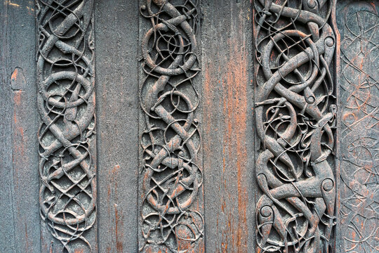 Exterior wooden carvings of the Urnes Stave Church, a UNESCO World Heritage Site, by Lustrafjorden in Norway.