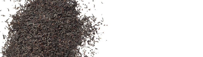 Black long tea on a white background. Top view of dried tea leaves. Tea composition. Ingredients for a hot drink, close-up. Background. Presentation of the type and variety of tea