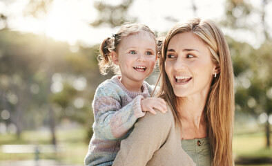 Obraz premium Happy, park and mom with child for playing for fun, bonding and playful relationship. Family, nature and mother carrying young girl for adventure outdoors for care, love and support on weekend