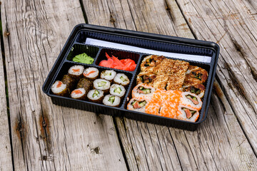 Set of the different sushi on wooden table