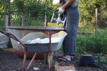 man working on a wheelbarrow