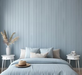 A blue bedroom with bed, nightstand and wall behind it. The walls of the room have vertical lines on them.