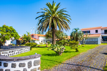Obraz premium Typical house with garden built in traditional colonial style in Madalena village, Pico island, Azores, Portugal