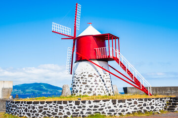 Historic windmill building among vineyard and volcanic rocks, Pico island, Azores, Portugal