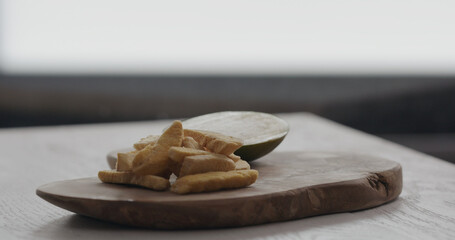 freeze dried mango on olive wood board