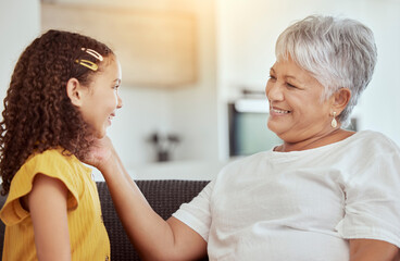 Grandmother, child and touch for love in home, affection and bonding or care in apartment living room. Family, grandchild and grandma on couch and happy on weekend, comfort and smile in house lounge