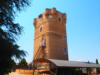 Brick tower of the Castle of Arroyomolinos, in Madrid, Spain, with cannonball impacts