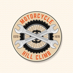 Motorcycle hill climb logo, badge, sticker. Vector. Extreme sport with motorcycle wheel and wrenches.