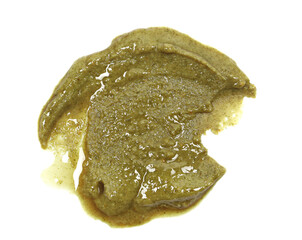 Organic pumpkin seeds butter spread isolated on white, top view, clipping path