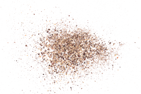 Minced black pepper, ground peppercorn pile flying isolated on white, macro