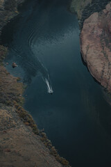 Aerial view of boat in river at Horseshoe Bend, Utah