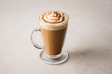 Delightful glass mug of cappuccino with lush cream foam and sprinkled with cinnamon. For cafe advertisement, cafeteria menu, coffee shop decor, brunch event, social media posts, coffee-related content