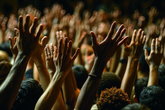 A powerful close-up shot capturing the intensity and unity of raised hands in a dynamic assembly, symbolizing collective energy, involvement, and strong community bonds.