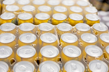 packaged energy drink or beer in yellow aluminum containers