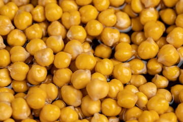 chickpeas porridge with honey during cooking