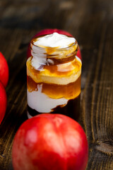 natural yogurt in a glass jar with fruits