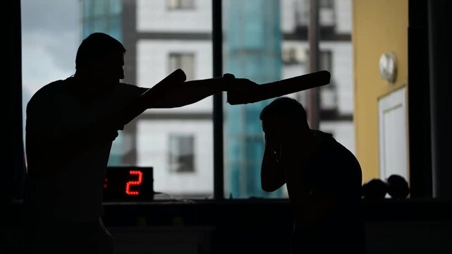 Silhouette of a Boxing Training