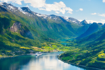 Norway. Cruise ship in the Norwegian fjord. High mountains and reflections on the surface of the...