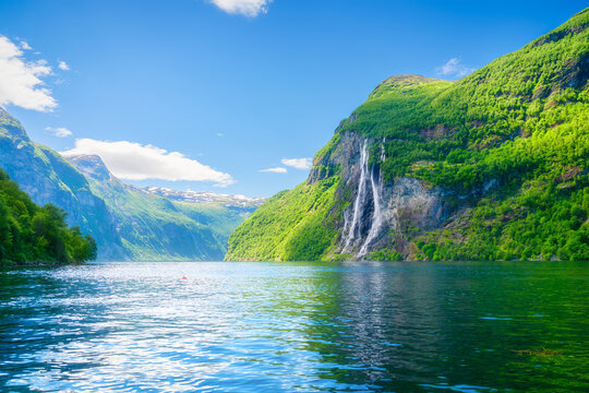 Seven Sisters Waterfall, Geiranger Fjord, Norway. Nature in fjords. Panoramic view. Traveling on a Norwegian fjord. Scandinavia. Vacation and travel in summer Norway.