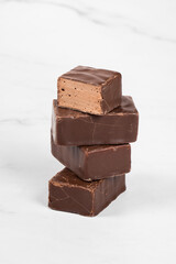Chocolate bird's milk. Chocolate souffle in chocolate glaze. White background. Close-up