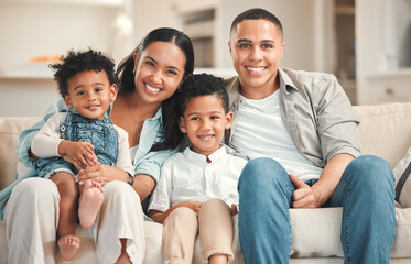 Fototapeta premium Family, portrait and happy on sofa in home, love and relationship with people together for weekend break. Apartment, smiling and parents with kids for bonding, holiday and relax in living room