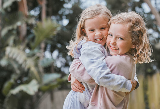 Garden, smile and siblings in portrait with hug, playful and bonding together with childhood games in park. Outdoor, children or girls with embrace for connection, development and carry in backyard