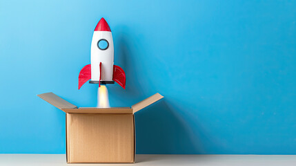 Rocket taking off from cardboard box on blue background creative and imaginative concept playful and whimsical scene vibrant and contrasting colors innovative and fun visual representation dynamic