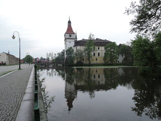 Obraz premium Blatna historical Gothic medieval water castle with towers and turrets, plus extensive grounds home to fallow deer and a cafe. 