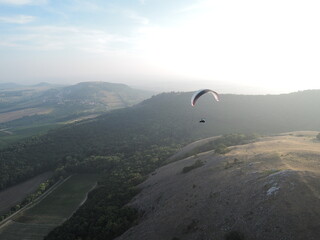 Paragliding over the Palava mountain range in Moravia, Czech Republic. A breathtaking experience, flying over a natural reserve with stunning views of the landscape.

