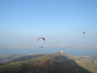 Paragliding over the Palava mountain range in Moravia, Czech Republic. A breathtaking experience, flying over a natural reserve with stunning views of the landscape.

