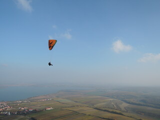 Paragliding over the Palava mountain range in Moravia, Czech Republic. A breathtaking experience, flying over a natural reserve with stunning views of the landscape.

