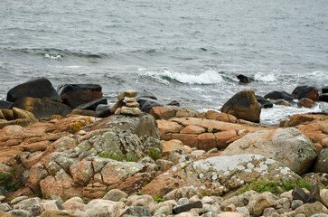 Coastal landscape with stones on the beach and salt water on the west coast of Sweden in summer.
