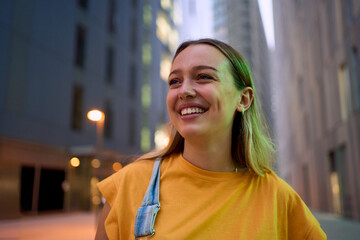 Copy space portrait of a young blonde Caucasian student girl positive expression standing in front...