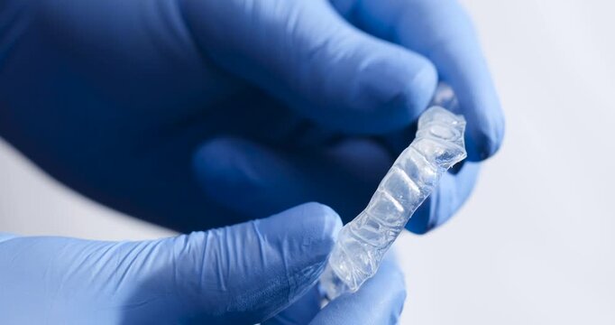 Dental Trays in the Hands of a Dentist.