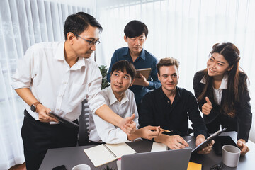 Group of diverse office worker employee working together on strategic business marketing planning in corporate office room. Positive teamwork in business workplace concept. Prudent