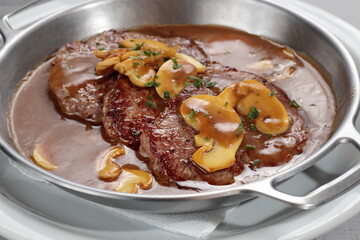 Filet mignon escalope with Madeira sauce and mushrooms with mashed potatoes