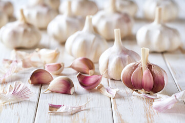 organic garlic on a white kitchen table, selective focus.