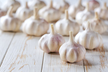 fresh garlic on a white wooden table, selective focus.