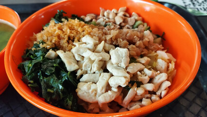 mixed vegetarian cuisine with nuts, tofu and greens