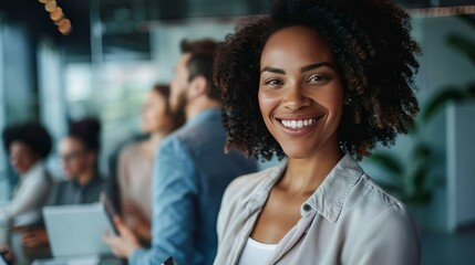 Fototapeta premium Smiling confident business leader looking at camera and standing in an office at team meeting. Portrait of confident businesswoman with colleagues in boardroom. Using digital tablet - generative ai