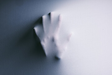 Figure, hands and person in fabric with mental health, problem and claustrophobic with haunted in sheet. Ghost, trapped and horror with nightmare, crisis and pressing cloth on black background mockup